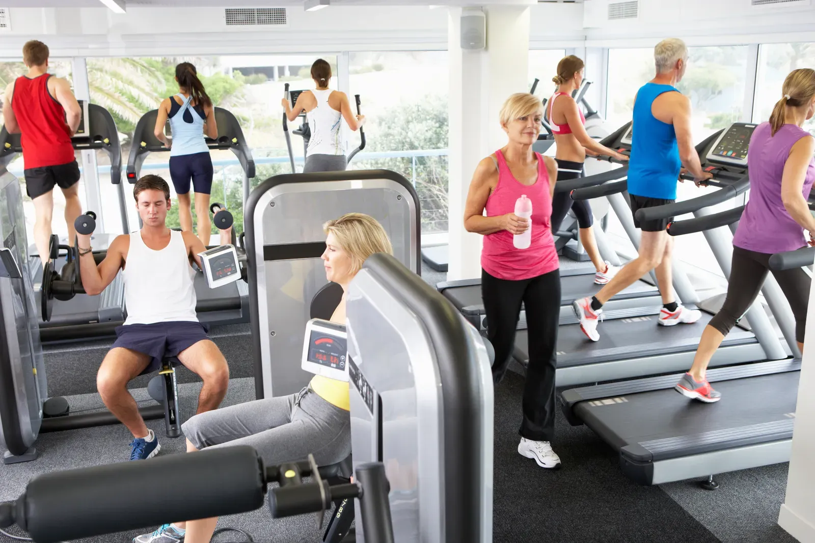 Crowded commercial gym floor during the January rush