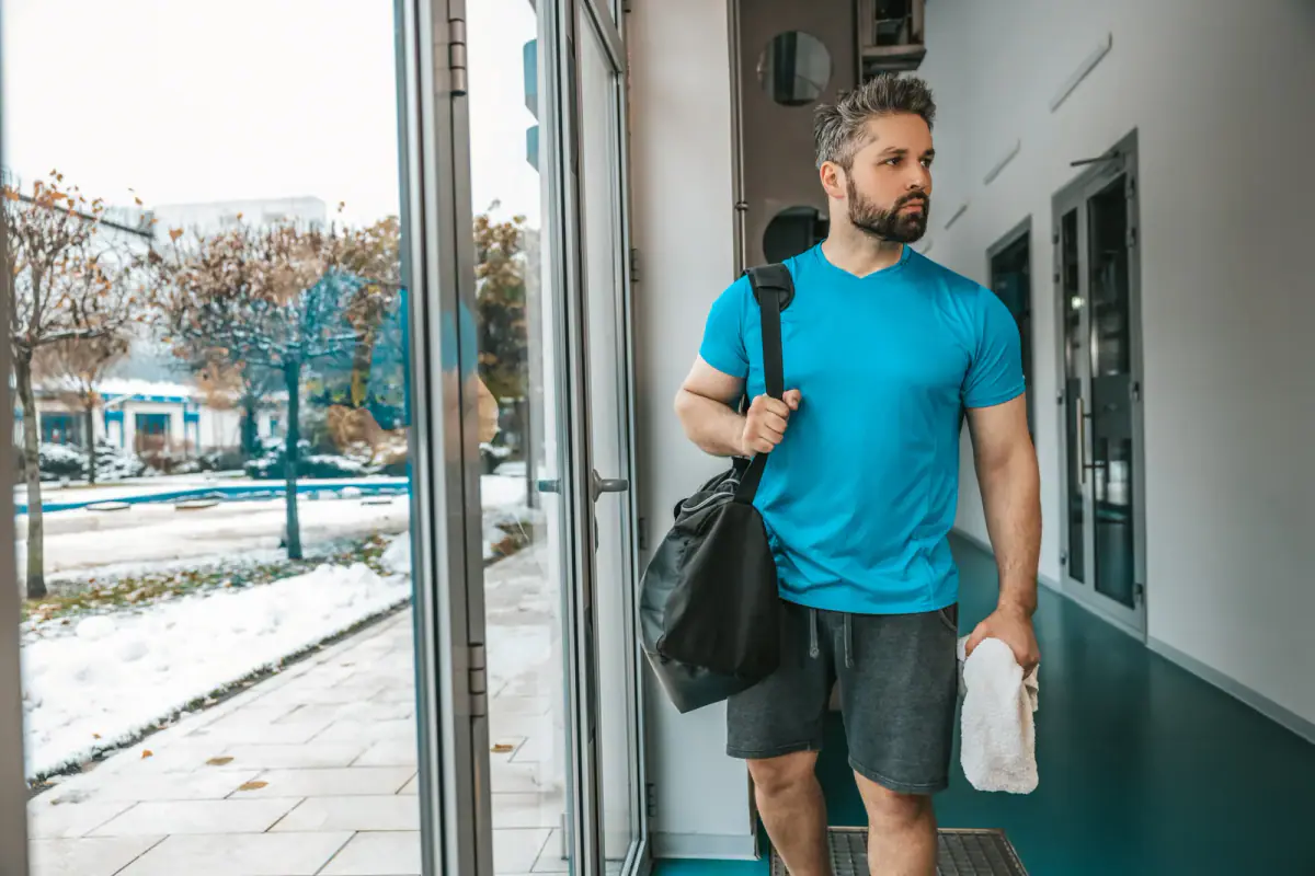 Athlete leaving the gym after a good workout, a moment that echoes deciding when to leave a gym job