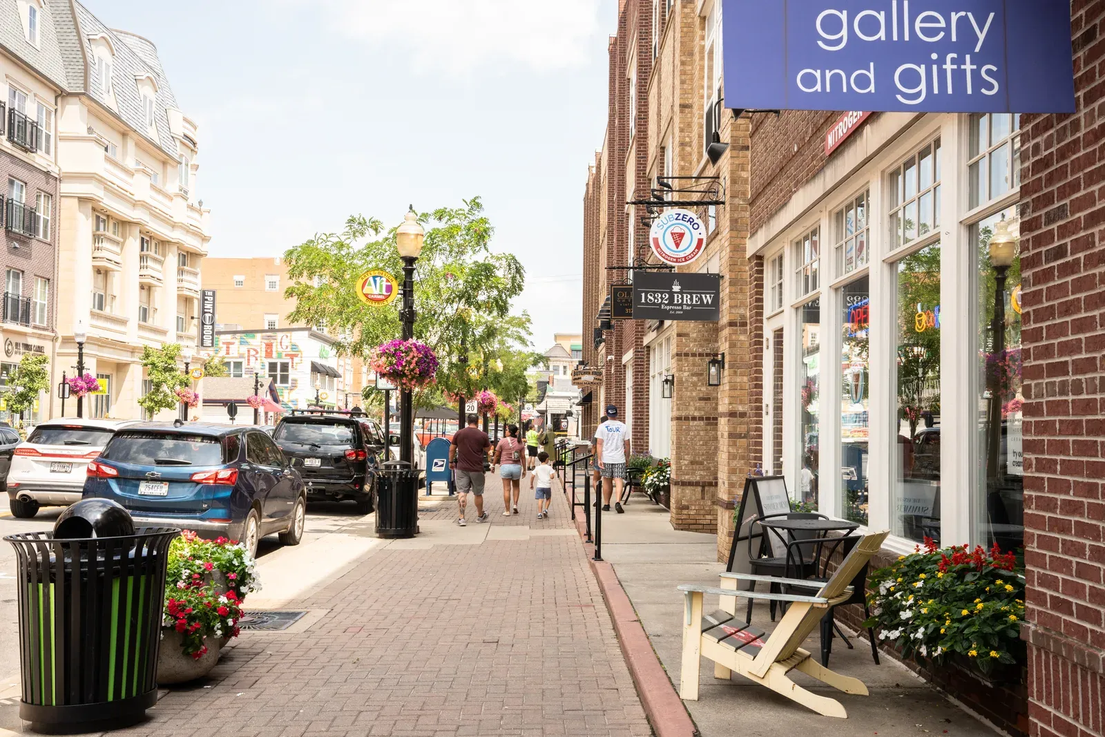 An upscale suburban downtown street lined with shops and offices