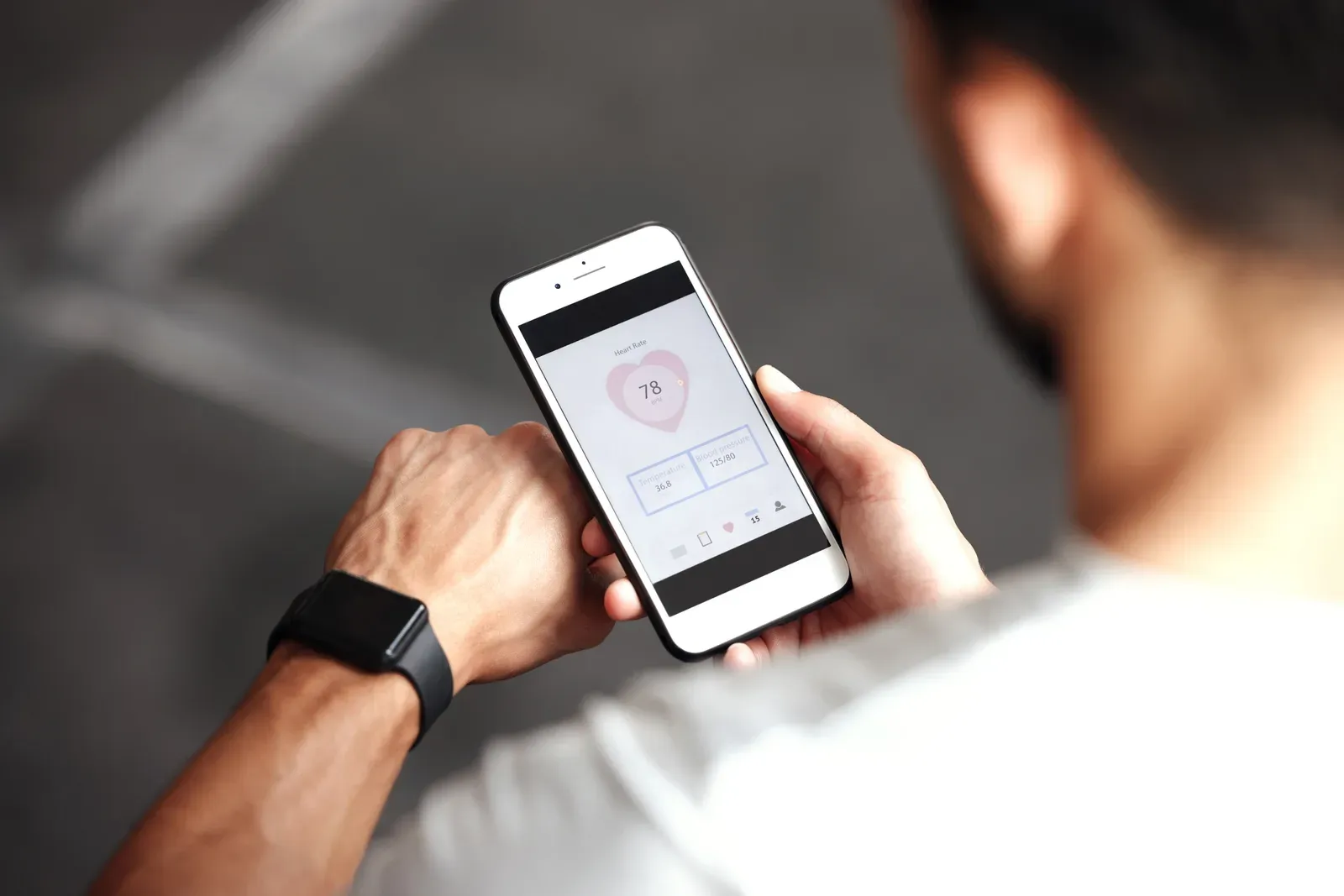 A close up of a smartwatch showing fitness metrics on a wrist