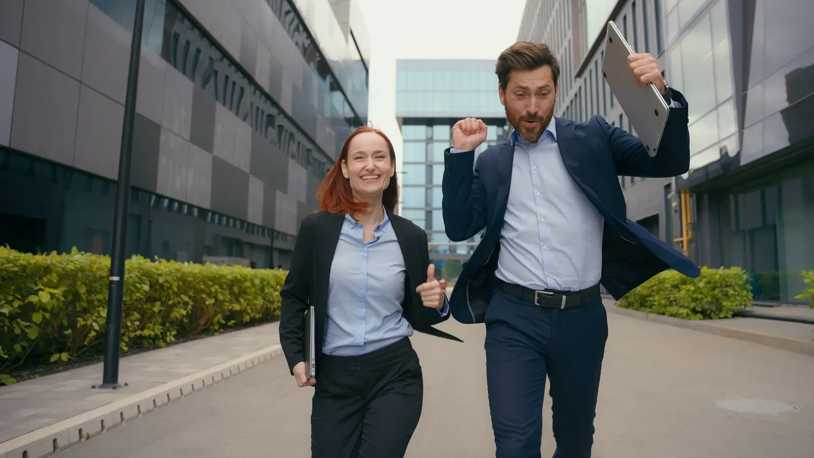 Office coworkers jogging together on a lunchtime training run