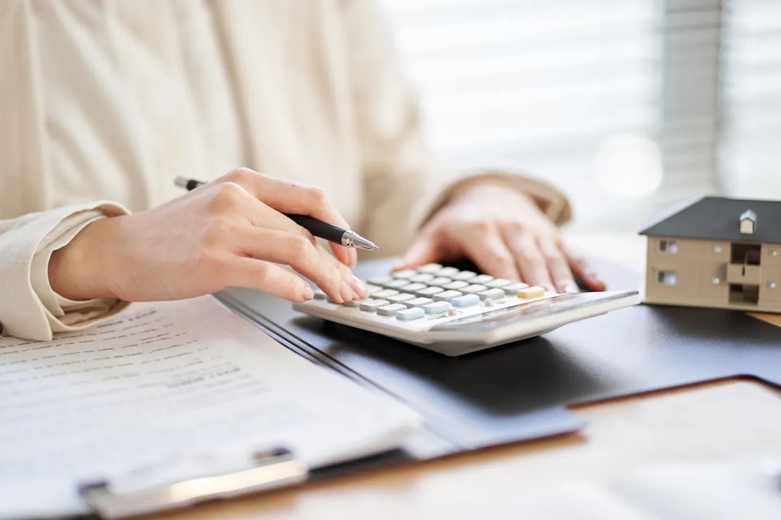 Women going over real estate rental quotes, sizing up gym space costs