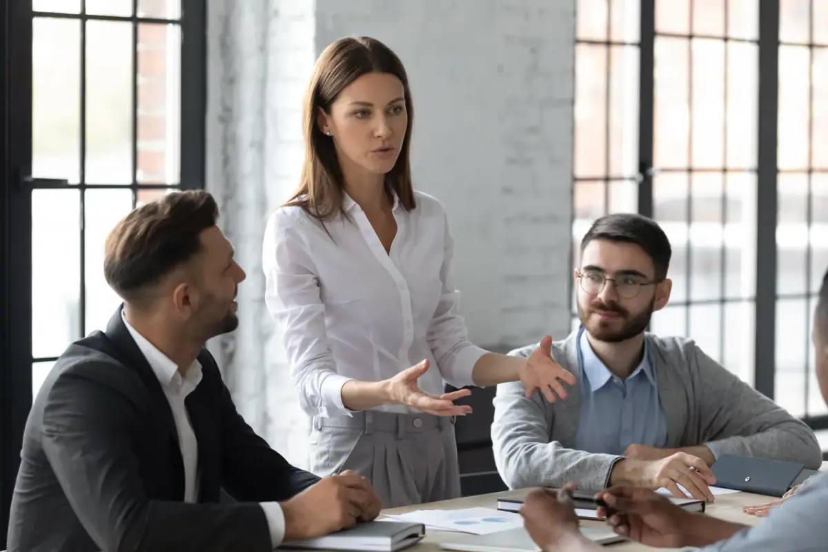 Young businesswoman mentor coaching in a boardroom, a type of room a coworking space offers for client consults