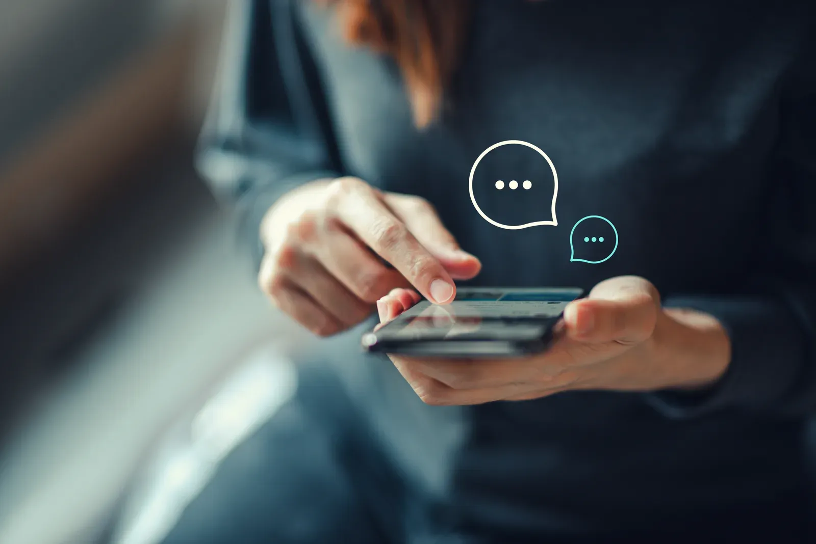 A person composing a text message campaign on a smartphone