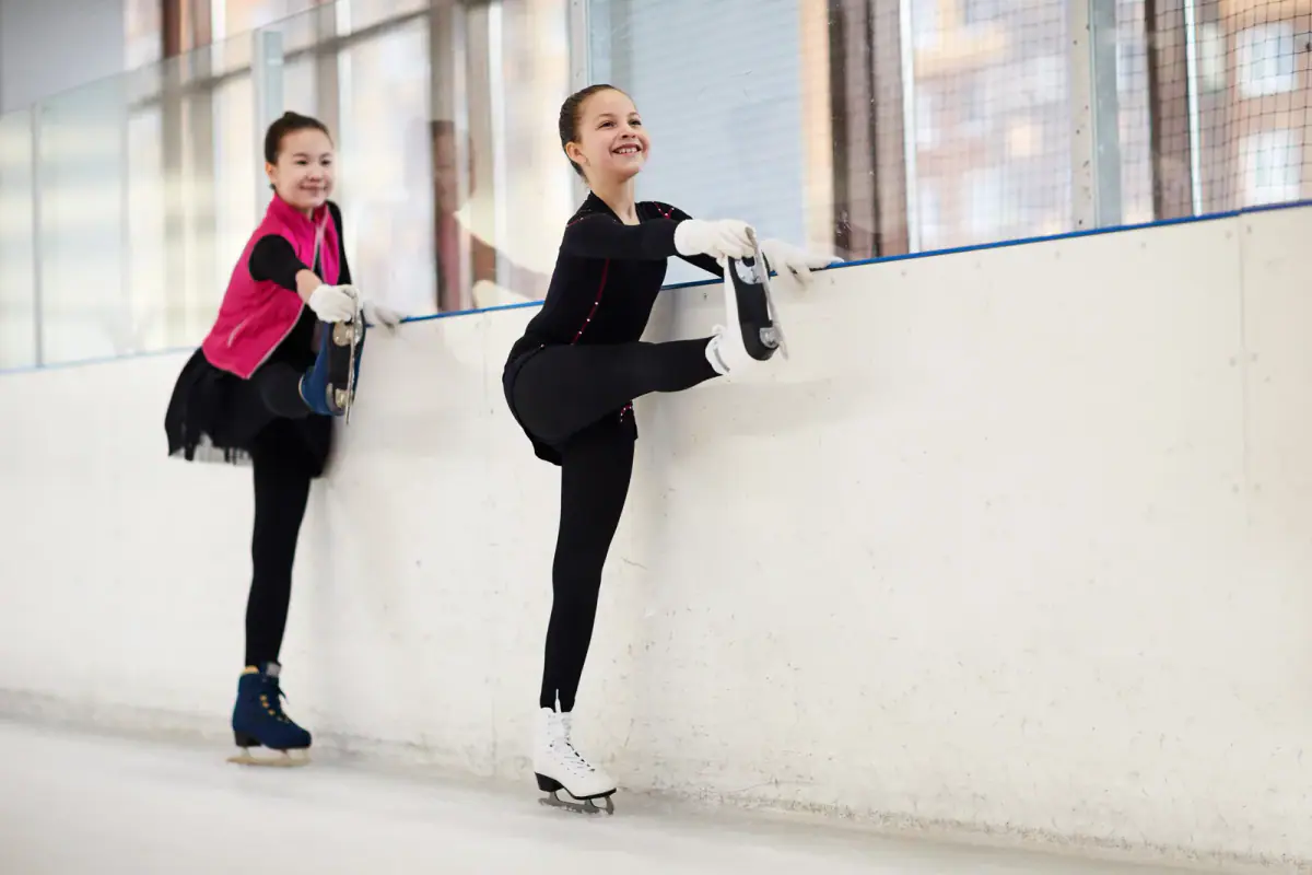 Figure skater stretching during an off ice training session