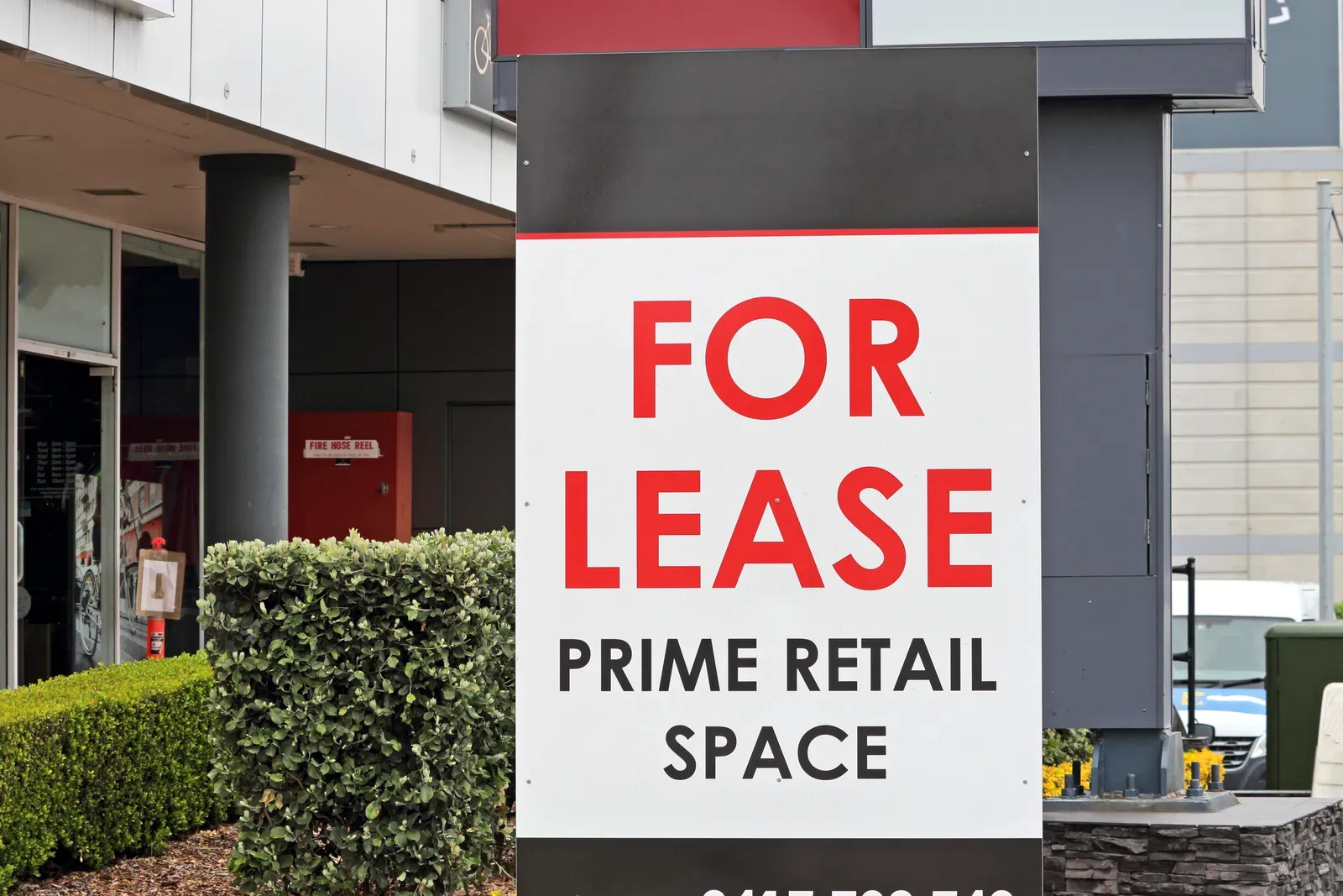 For lease sign in the window of an empty commercial studio space