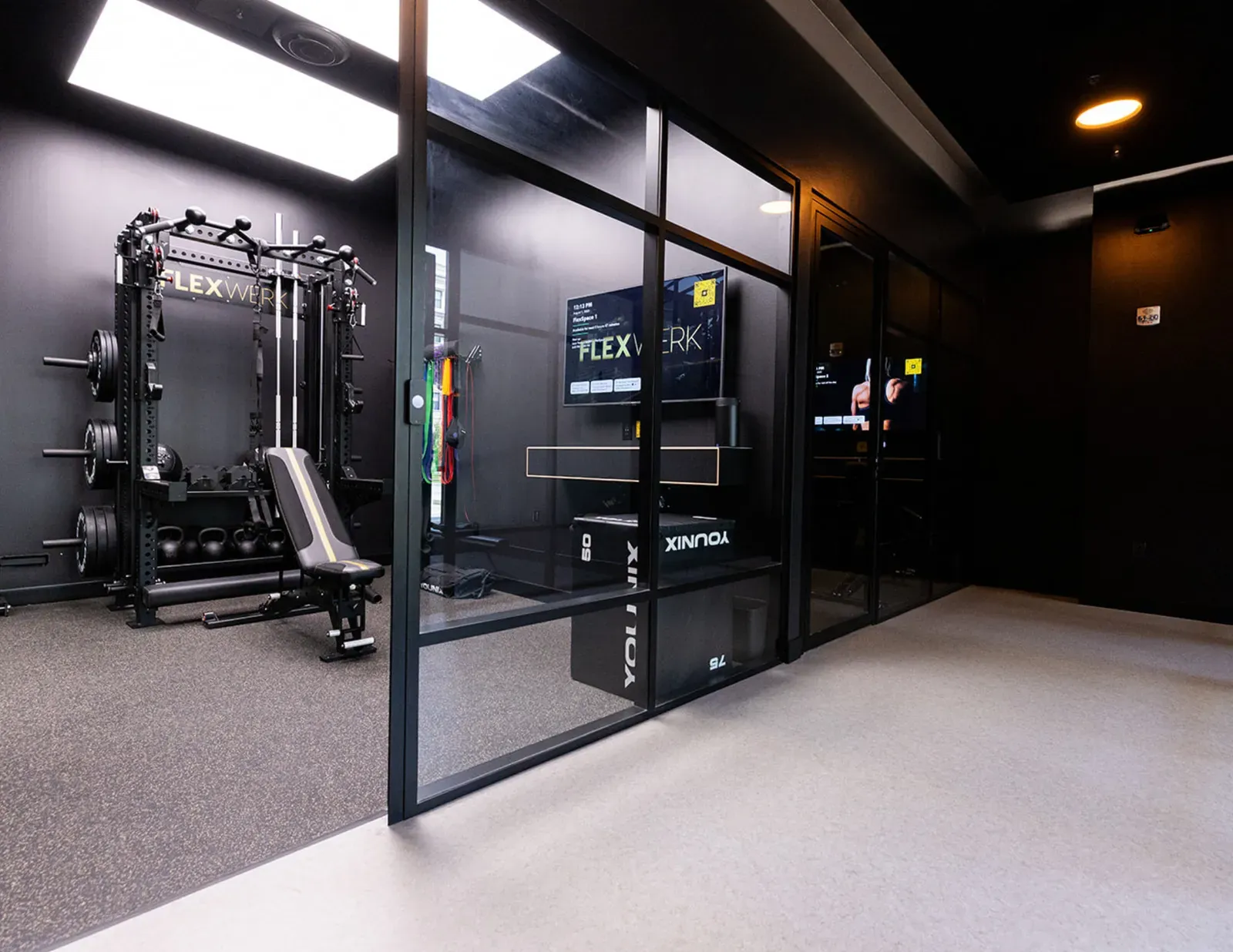 Glass doors opening into a private workout space at FlexWerk in Carmel