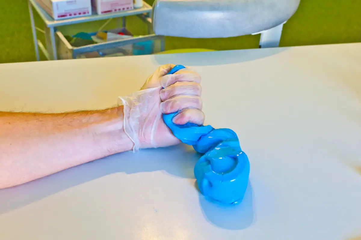 Hand physiotherapy to recover a finger, a service that a cash practice offers in a hand therapy space