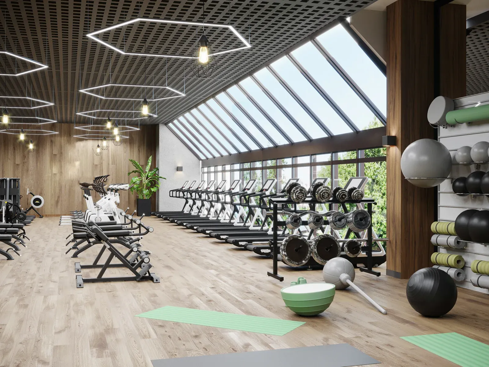 Empty modern gym interior with weights racked and the lights on