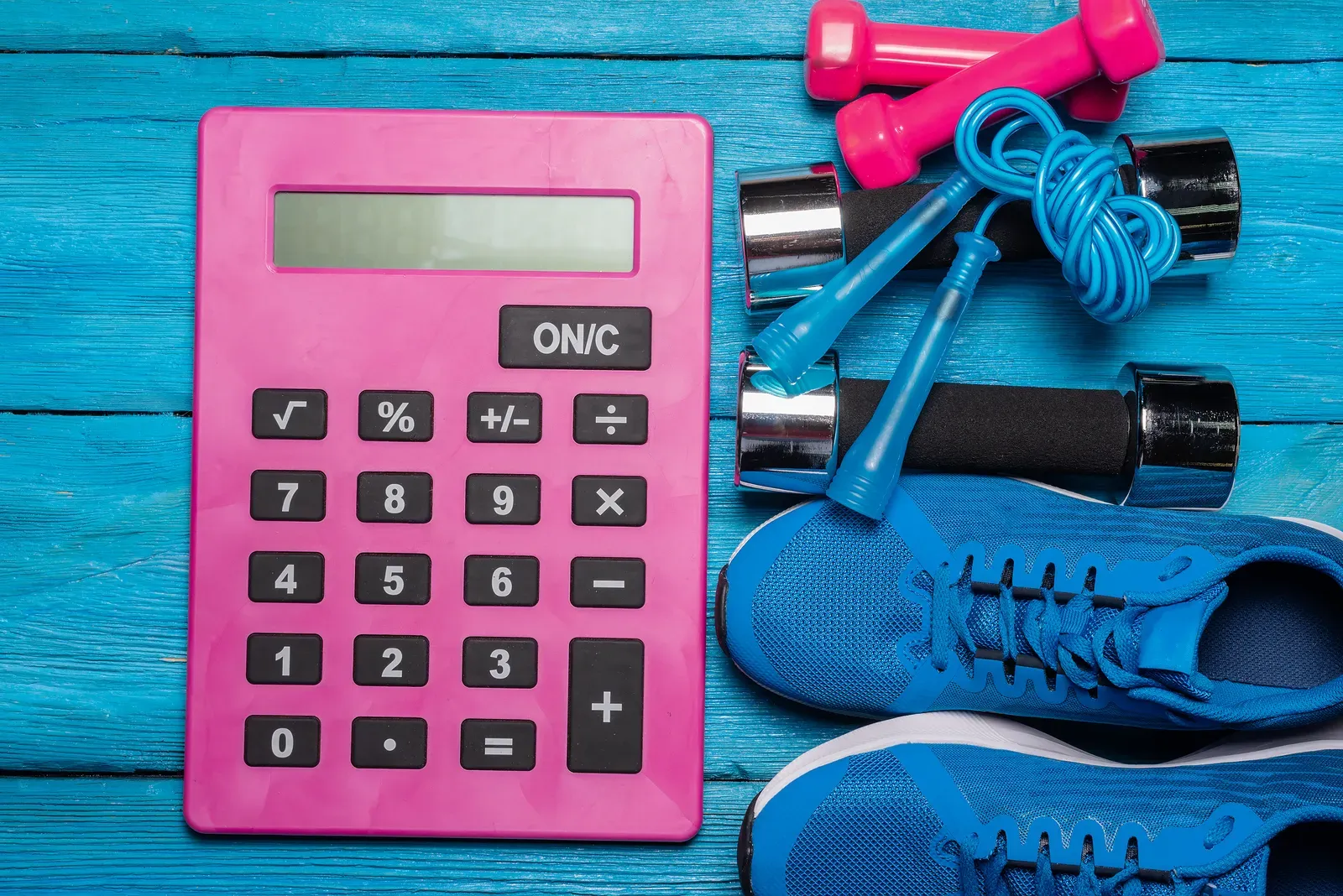 Calculator and notebook used to budget space rental costs