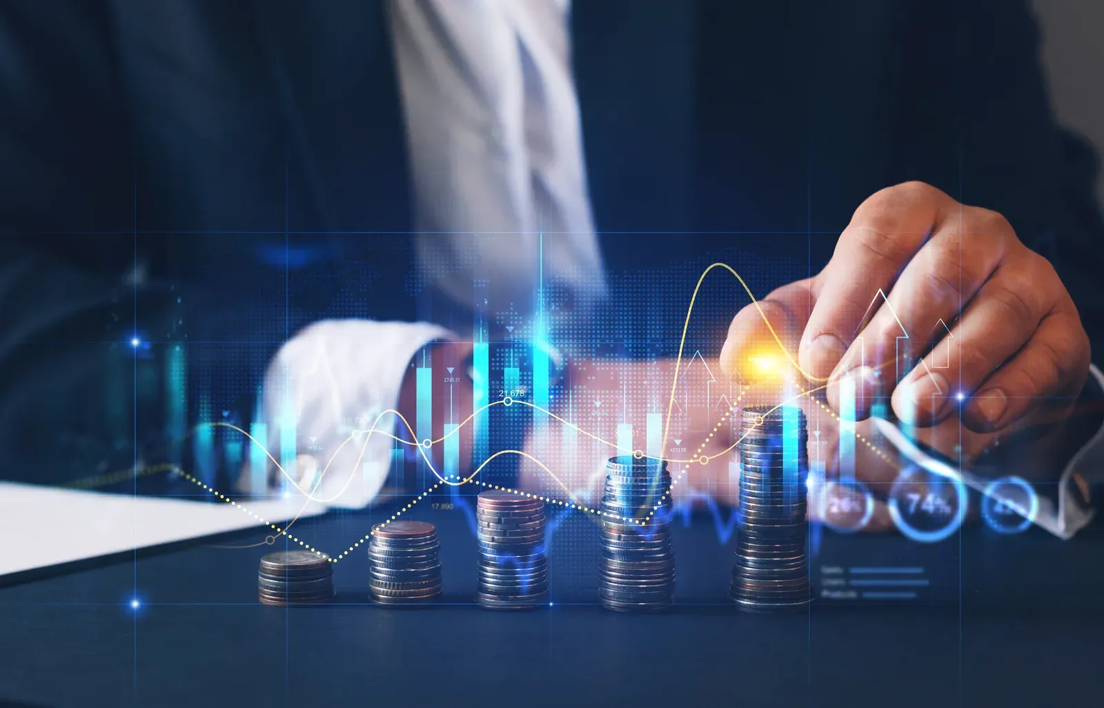 Coins stacked beside financial growth charts and market data