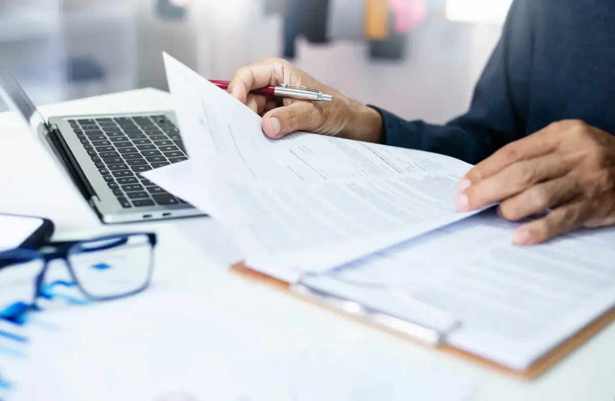Business and finance paperwork that shapes a trainer's insurance decision