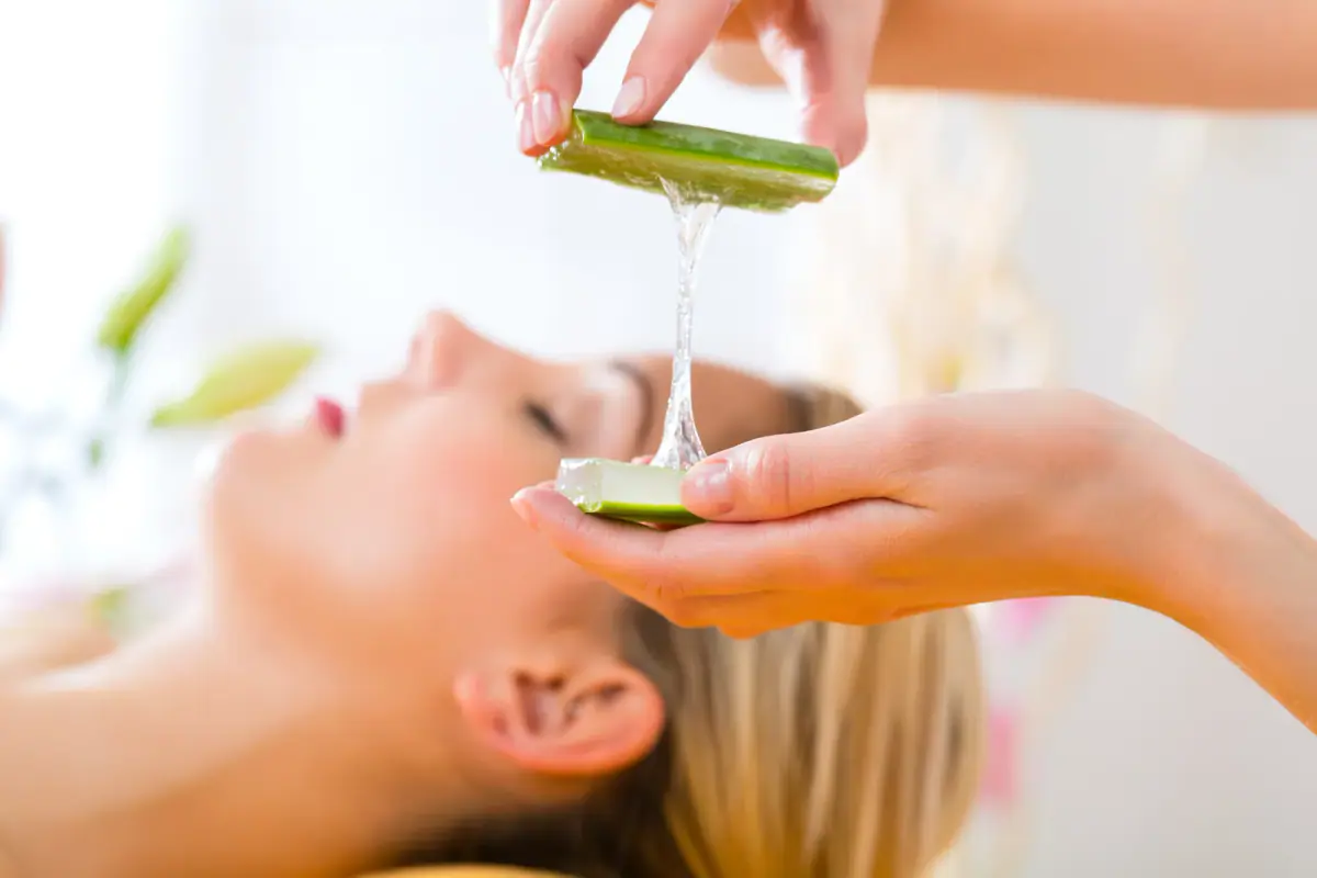 Woman receiving a head massage at a spa, a client a massage therapist may want to keep when leaving a spa