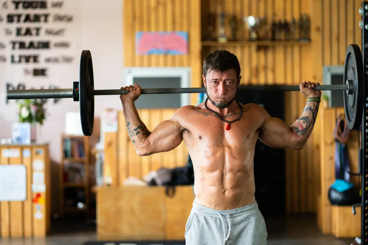 A lifter setting up for a heavy squat inside a power rack
