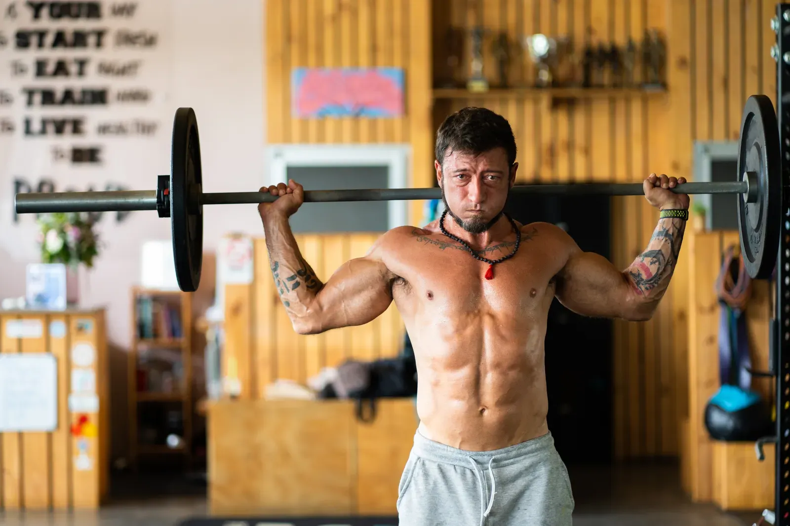 A lifter setting up for a heavy squat inside a power rack