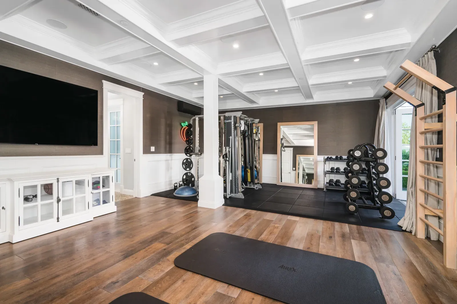 Upscale private gym interior with premium equipment and moody lighting