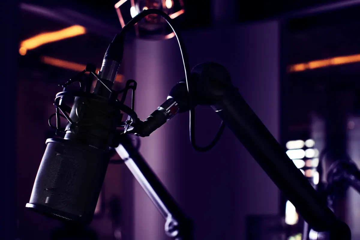 A professional microphone in a podcast studio, relevant to recording a fitness podcast in a rented room