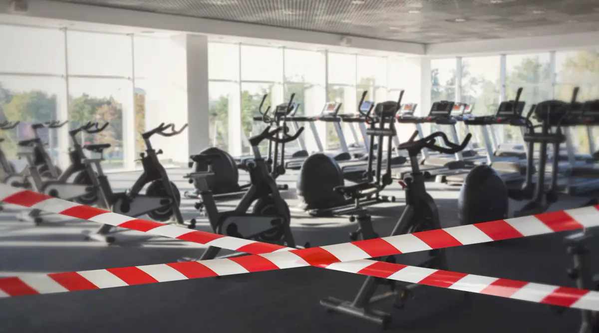 Hazard safety stripes across an empty, closed gym, a warning sign to watch for when renting a training space