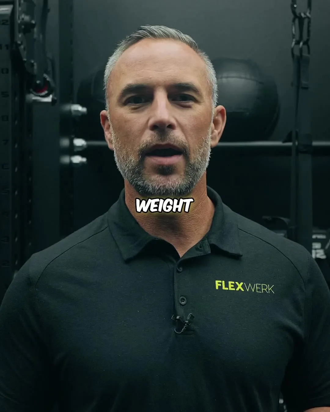 A coach speaking to the camera in a FlexWerk video filmed inside a suite