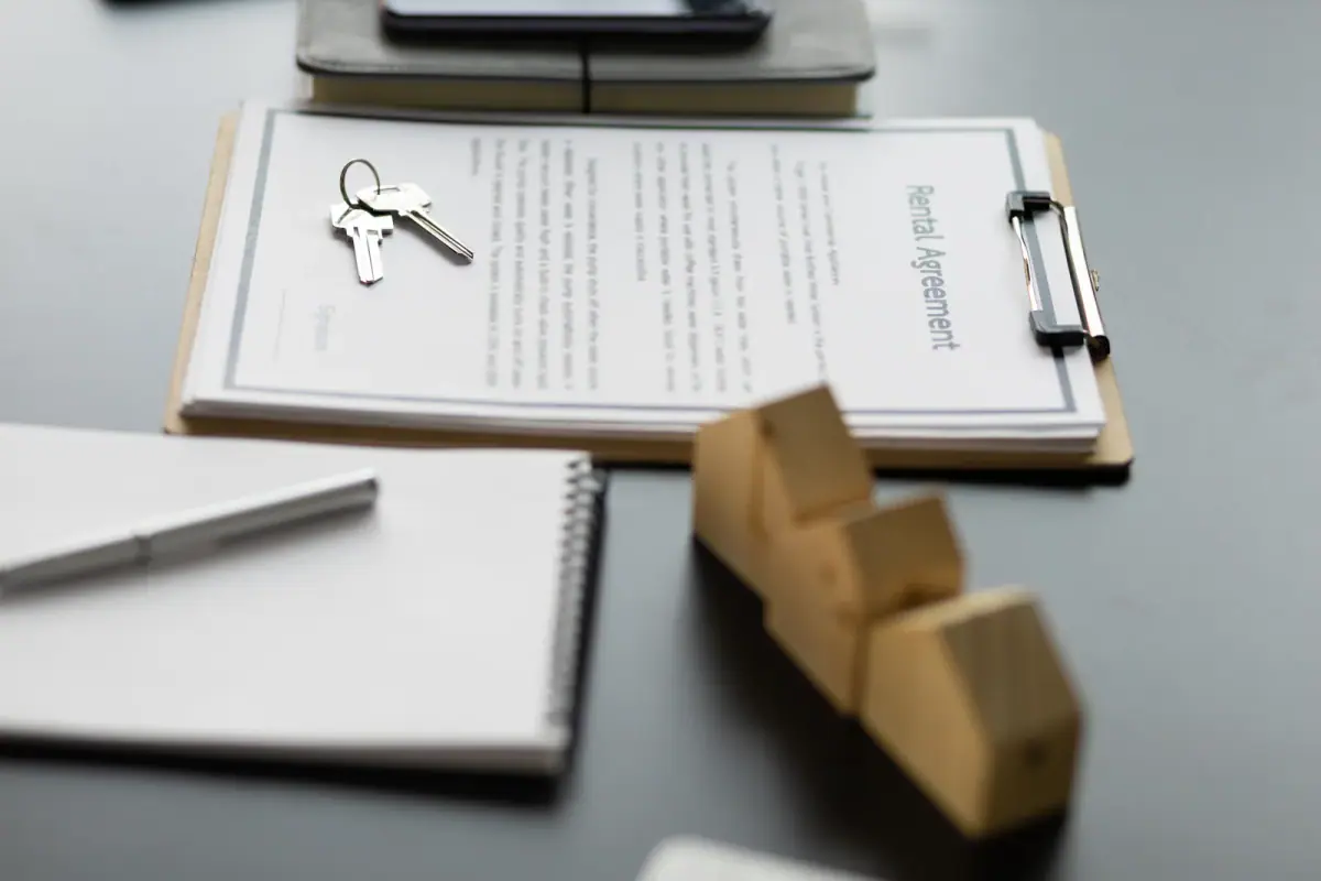 A close-up of a rental contract agreement, relevant to working out rent per square foot for a training studio