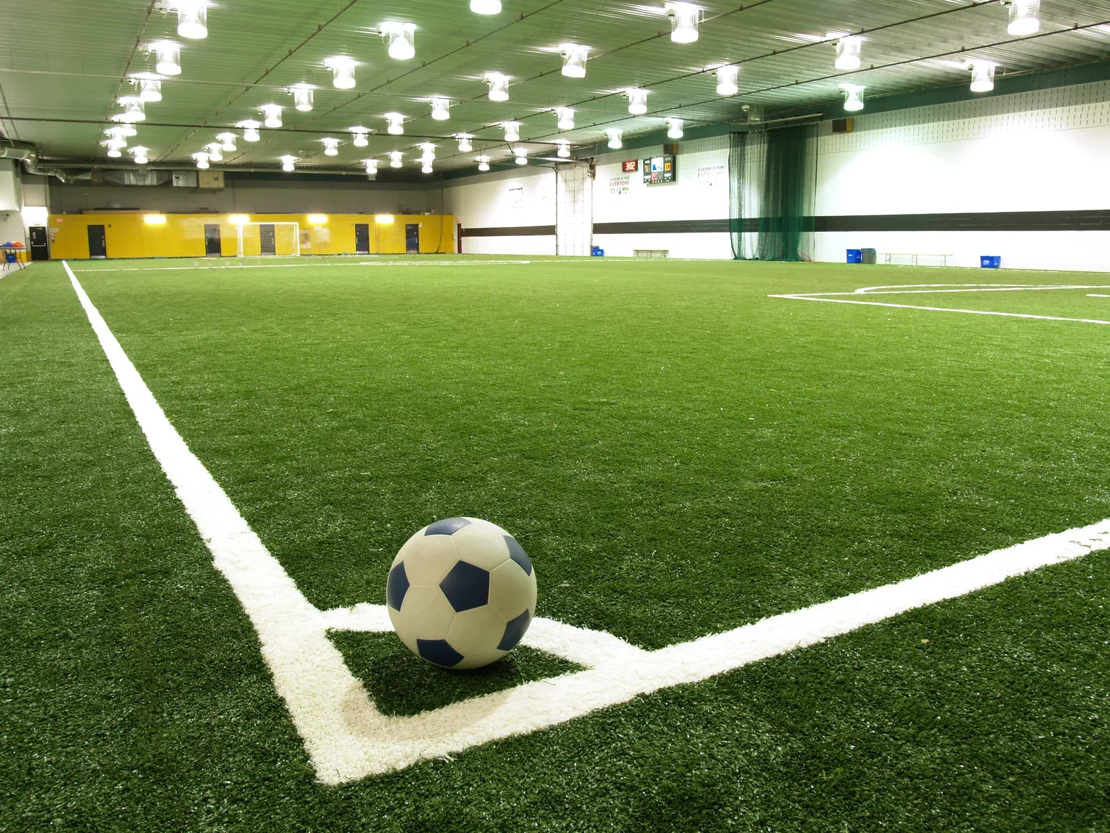 Young soccer players warming up on a field before a showcase event