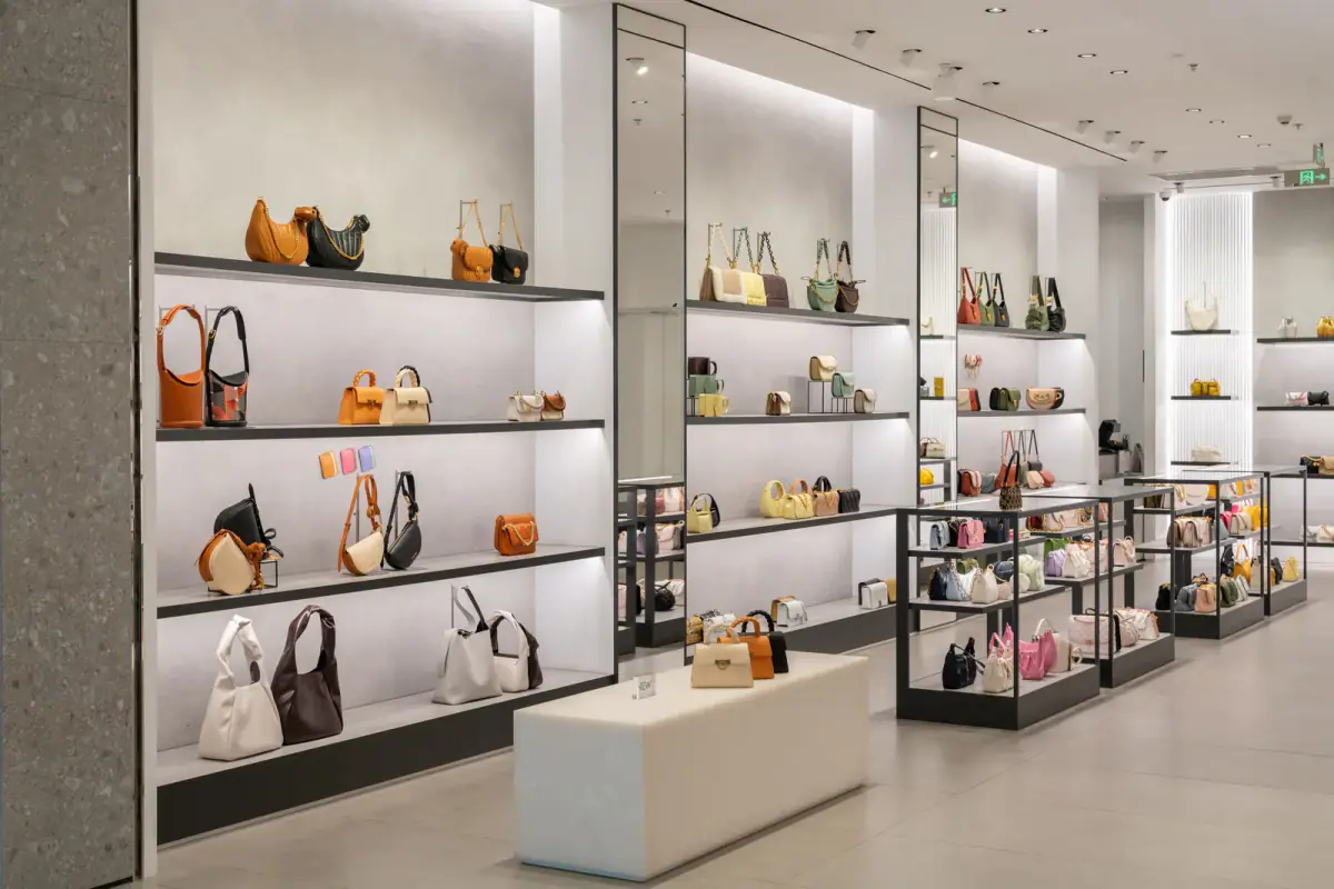 Luxury store front in a modern shopping mall, a small retail unit that a training studio might rent