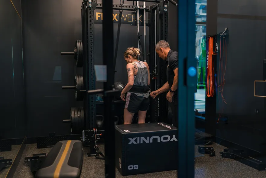 Coach training a client in a private FlexWerk space