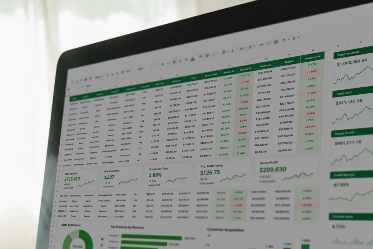 Spreadsheet dashboard on a laptop tracking revenue, costs and profit margins