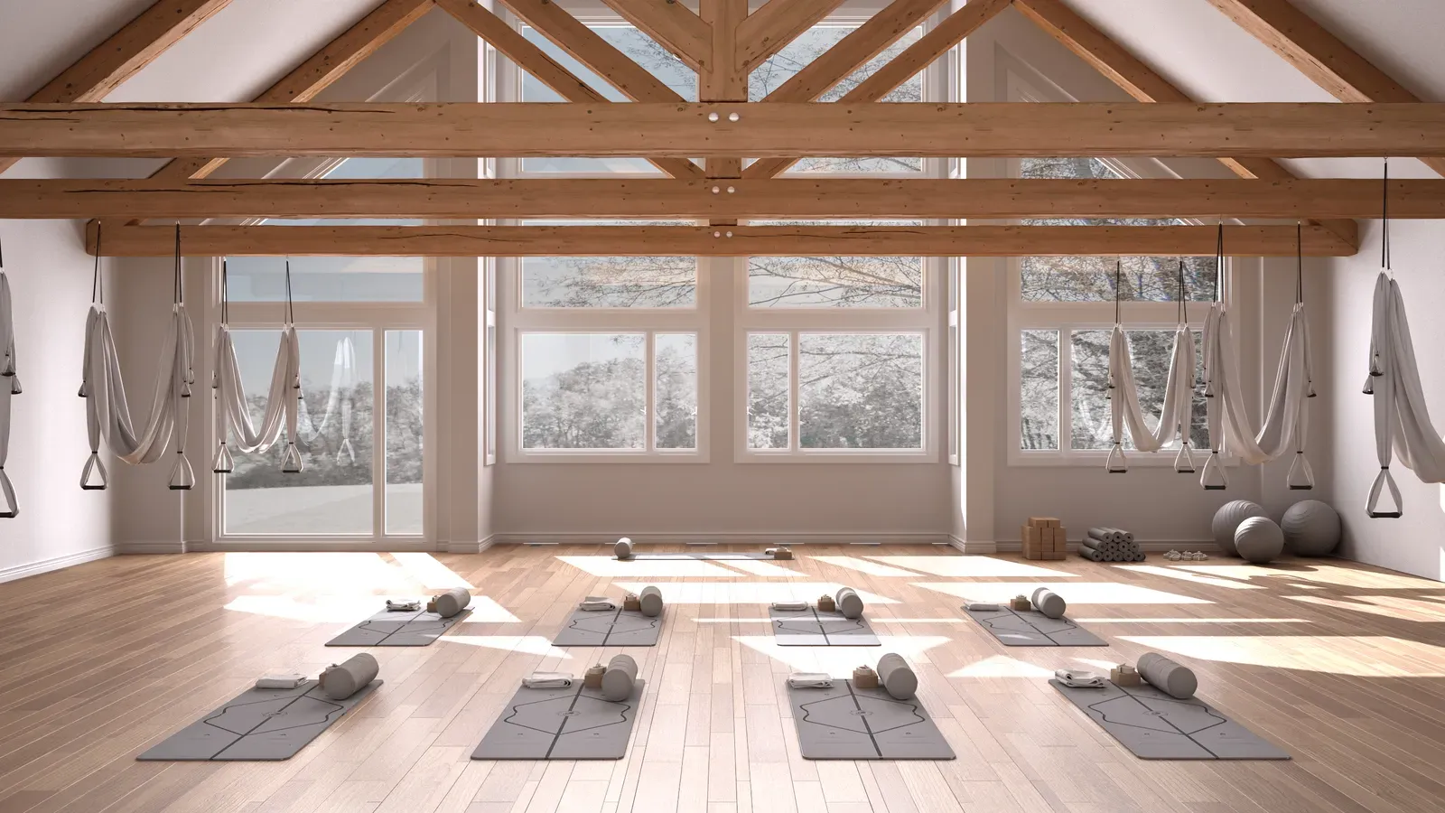 Interior of a small training studio with racks and free weights