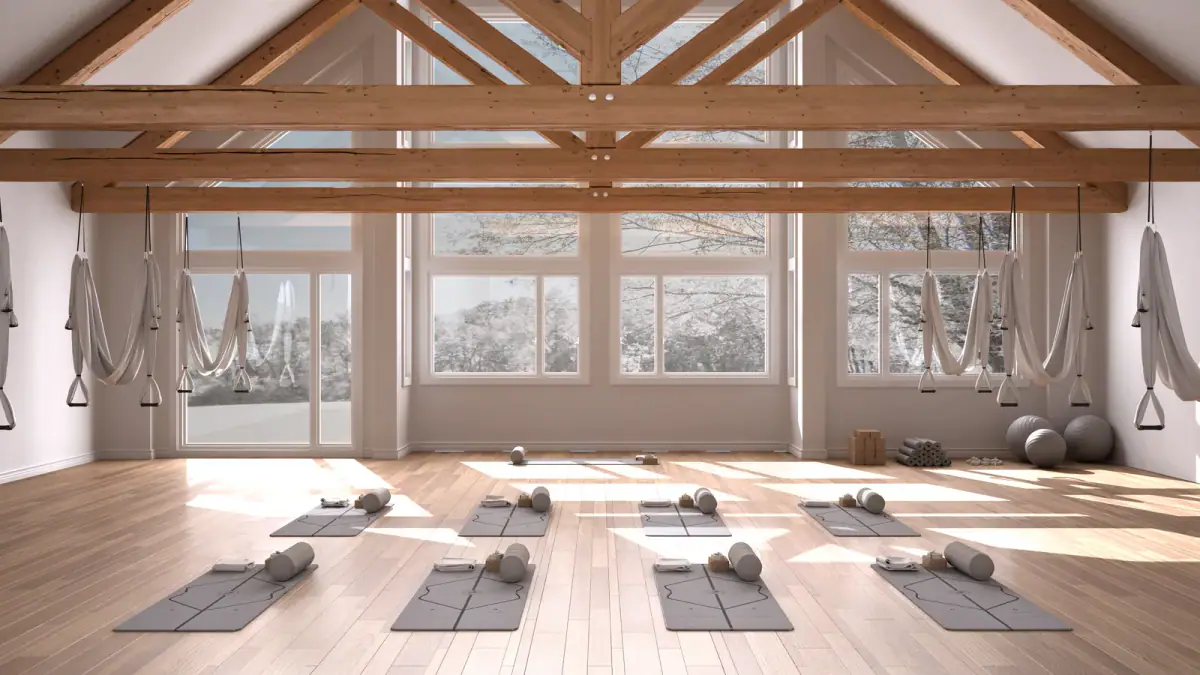 Interior of a small training studio with racks and free weights