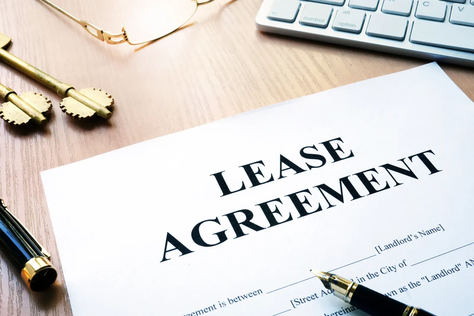 A rental lease agreement form laid out on an office desk