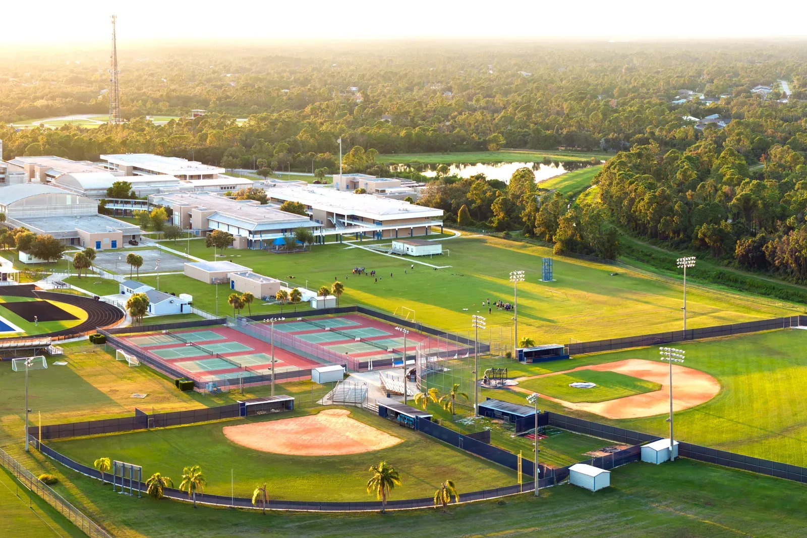 Aerial view of a large youth sports complex with fields, diamonds, and courts