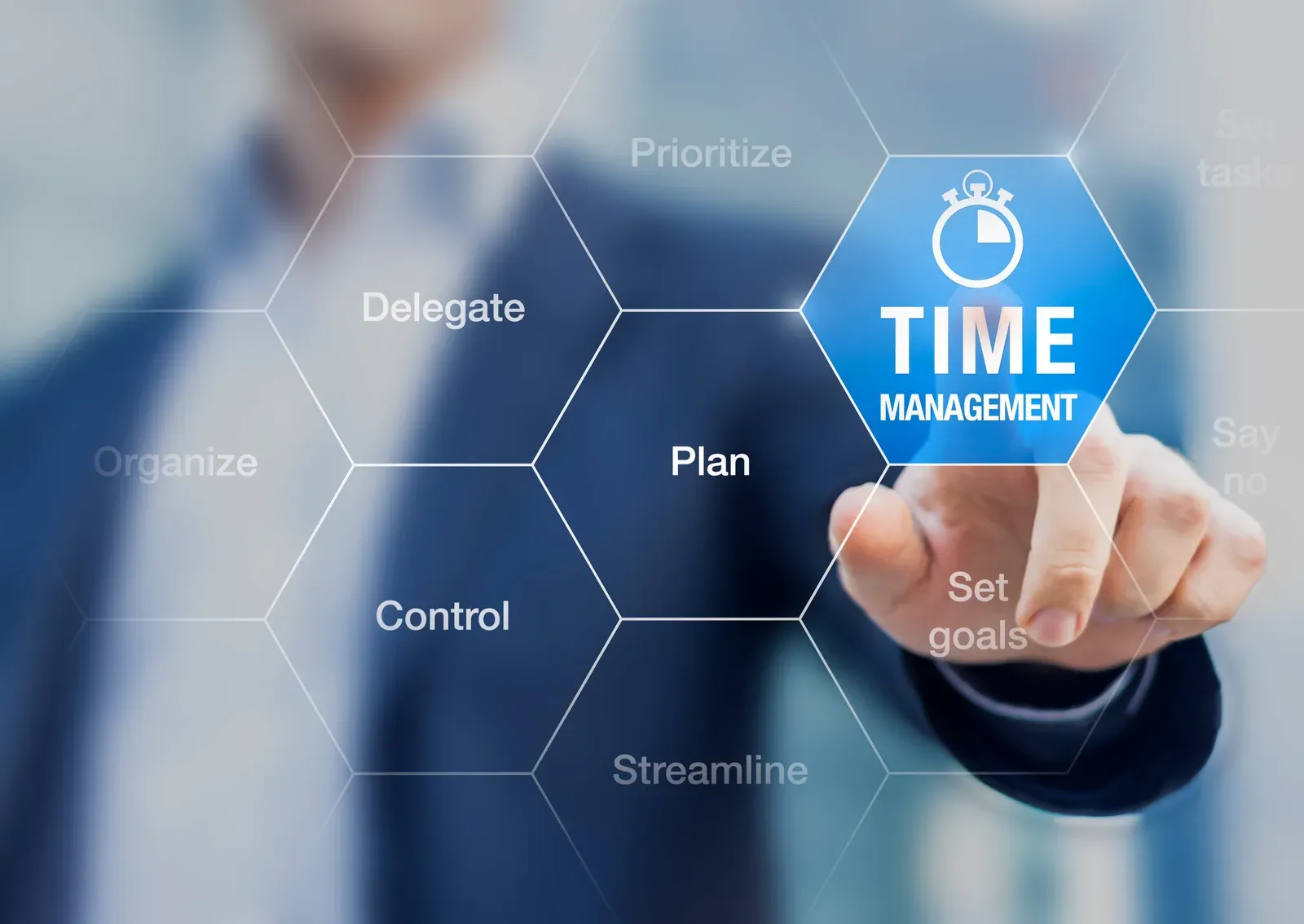 Hand pointing at a planning graphic about time management and scheduling