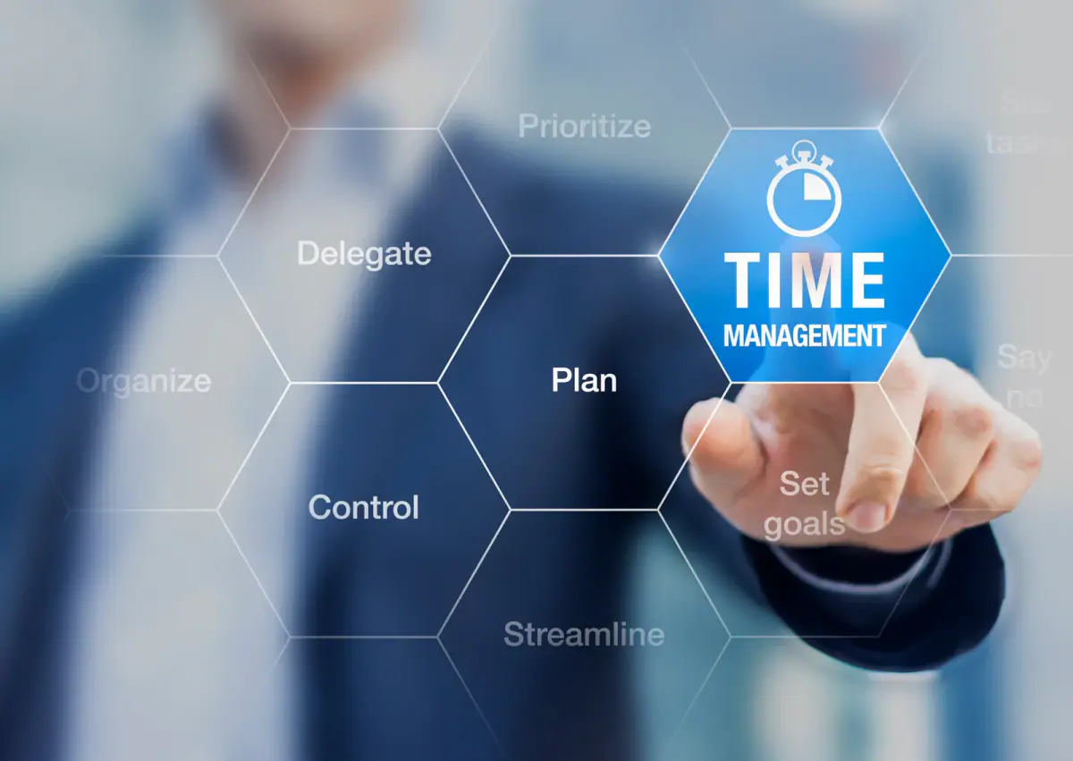 Hand pointing at a planning graphic about time management and scheduling